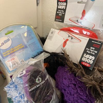 Large group of cleaning supplies