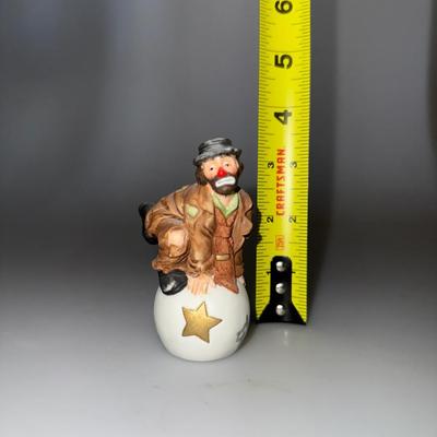 Emmett Kelly Jr. Clown Porcelain Figurine by Flambro, featuring a charming design of a kneeling clown with a white ball and a gold star.