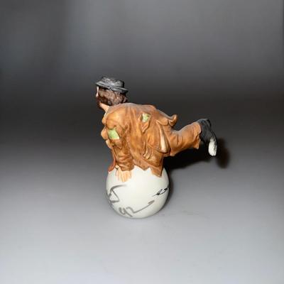 Emmett Kelly Jr. Clown Porcelain Figurine by Flambro, featuring a charming design of a kneeling clown with a white ball and a gold star.