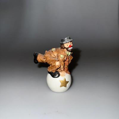 Emmett Kelly Jr. Clown Porcelain Figurine by Flambro, featuring a charming design of a kneeling clown with a white ball and a gold star.