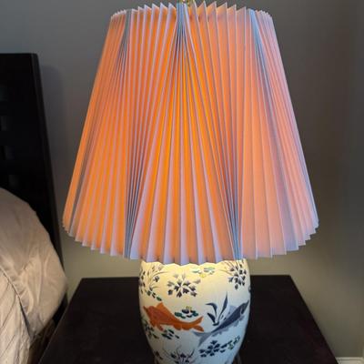 Sale Photo Thumbnail #58: The FJ Design table lamp features a vintage style with a classic design, perfect for adding a touch of elegance to your living room. Crafted from ceramic and fabric, this multicolor lamp stands 27 inches tall. It is pre-owned.