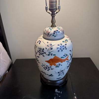 Sale Photo Thumbnail #63: The FJ Design table lamp features a vintage style with a classic design, perfect for adding a touch of elegance to your living room. Crafted from ceramic and fabric, this multicolor lamp stands 27 inches tall. It is pre-owned.