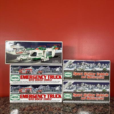 LOT 83C: Hess Trucks w/ Box - Sport Utility Vehicle w/ Motorcycles, Emergency Truck & More
