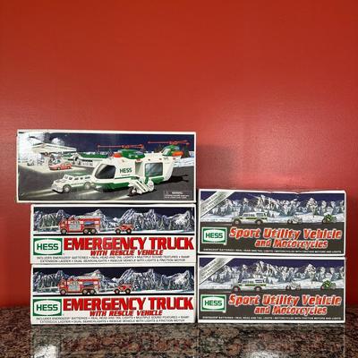 LOT 83C: Hess Trucks w/ Box - Sport Utility Vehicle w/ Motorcycles, Emergency Truck & More