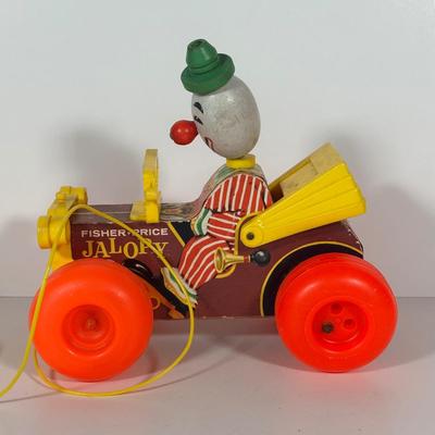 LOT 103C: Vintage Children’s Toys - Fisher Price 1965 Jolly Jalopy & Little Snoopy pull toys, Joanne Fox Jack in the Box & More