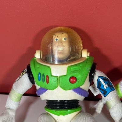 LOT 116C: Disney Collectibles - Wind Up Musical Toy, Figures, Buzz Lightyear Plush Toys & More