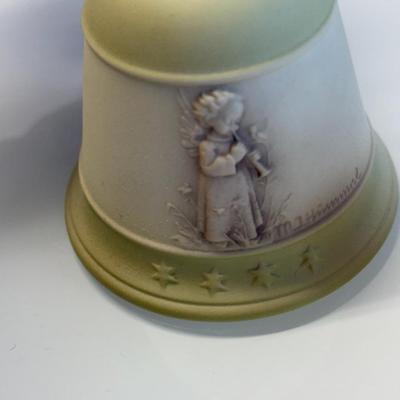 This lot of three M.J. Hummel Christmas bell ornaments