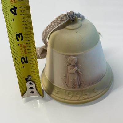 This lot of three M.J. Hummel Christmas bell ornaments