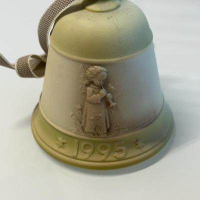 This lot of three M.J. Hummel Christmas bell ornaments