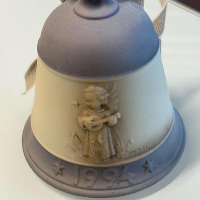 This lot of three M.J. Hummel Christmas bell ornaments