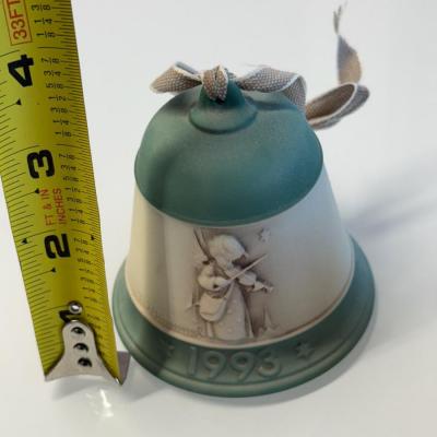 This lot of three M.J. Hummel Christmas bell ornaments