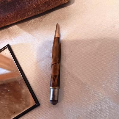 ANTIQUE TOOLED LEATHER PURSE, PENCIL AND MIRROR
