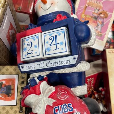 Blue tote with hallmark ornaments and cubs calendar