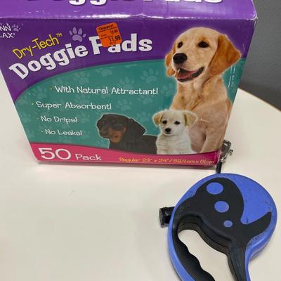 Box of Puppy pads and leash