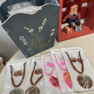 Raggedy any and wood decor with fashion jewelry