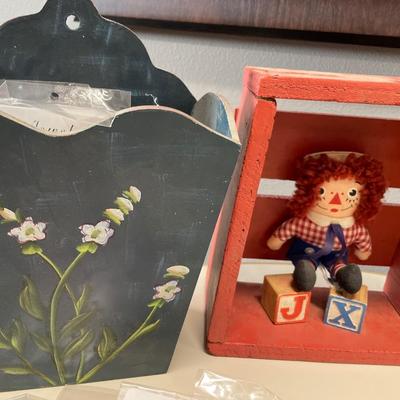 Raggedy any and wood decor with fashion jewelry