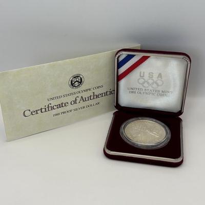 LOT 246: Unites States Constitution 1987 Silver Dollar, United States Olympic Coin 1988 Proof Silver Dollar, United States Proclaining...