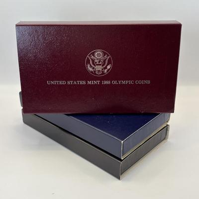 LOT 246: Unites States Constitution 1987 Silver Dollar, United States Olympic Coin 1988 Proof Silver Dollar, United States Proclaining...