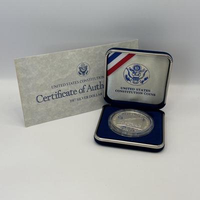 LOT 246: Unites States Constitution 1987 Silver Dollar, United States Olympic Coin 1988 Proof Silver Dollar, United States Proclaining...