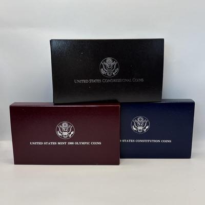 LOT 246: Unites States Constitution 1987 Silver Dollar, United States Olympic Coin 1988 Proof Silver Dollar, United States Proclaining...