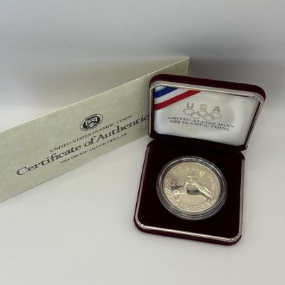 LOT 246: Unites States Constitution 1987 Silver Dollar, United States Olympic Coin 1988 Proof Silver Dollar, United States Proclaining...