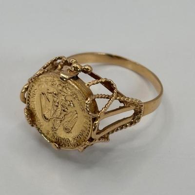 LOT 300: 1945 Dos Pesos Mexican Gold Coin Ring Size 6.5, 18k Gold (Tested) The Coin is 1.66g and 90% Gold and the Setting is 18K Gold.