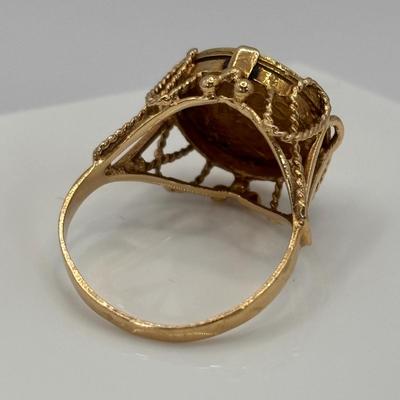 LOT 300: 1945 Dos Pesos Mexican Gold Coin Ring Size 6.5, 18k Gold (Tested) The Coin is 1.66g and 90% Gold and the Setting is 18K Gold.