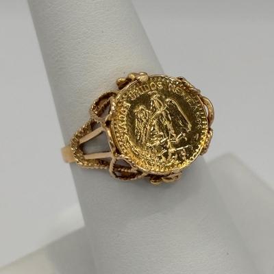 LOT 300: 1945 Dos Pesos Mexican Gold Coin Ring Size 6.5, 18k Gold (Tested) The Coin is 1.66g and 90% Gold and the Setting is 18K Gold.