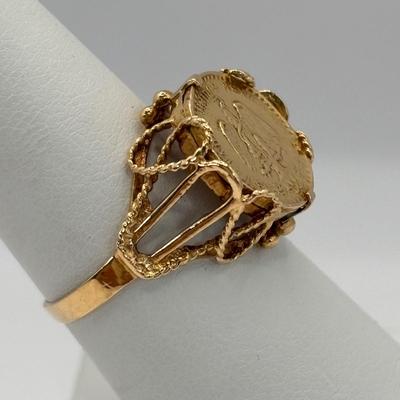LOT 300: 1945 Dos Pesos Mexican Gold Coin Ring Size 6.5, 18k Gold (Tested) The Coin is 1.66g and 90% Gold and the Setting is 18K Gold.