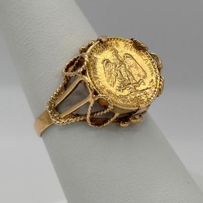 LOT 300: 1945 Dos Pesos Mexican Gold Coin Ring Size 6.5, 18k Gold (Tested) The Coin is 1.66g and 90% Gold and the Setting is 18K Gold.