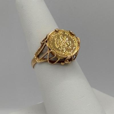 LOT 300: 1945 Dos Pesos Mexican Gold Coin Ring Size 6.5, 18k Gold (Tested) The Coin is 1.66g and 90% Gold and the Setting is 18K Gold.