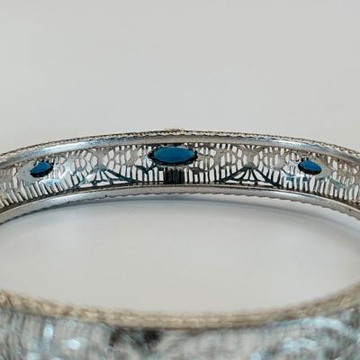 LOT 318: Art Deco Chromium Plated Filagree Hinged Bangle Bracelet w/ Saftey Chain and Blue Paste (Glass) and Clear Rhinestones Marked JHP...