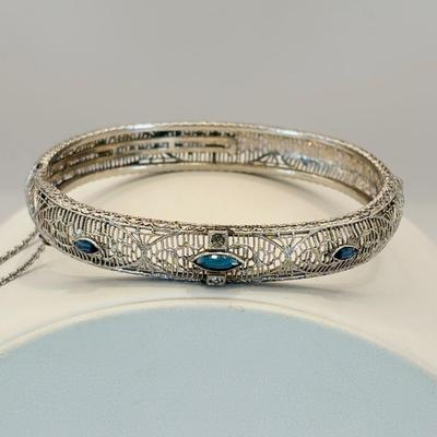 LOT 318: Art Deco Chromium Plated Filagree Hinged Bangle Bracelet w/ Saftey Chain and Blue Paste (Glass) and Clear Rhinestones Marked JHP...