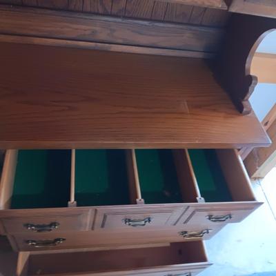 DINING ROOM HUTCH WITH AN ABUNDANCE OF STORAGE AND 12 STEMMED GLASSES