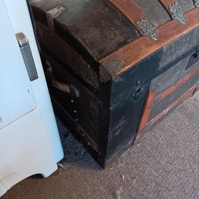 ANTIQUE TRUNK WITH DECORATIVE TIN AND LEATHER STRAPS