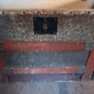 ANTIQUE TRUNK WITH DECORATIVE TIN AND LEATHER STRAPS