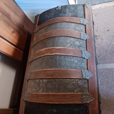 ANTIQUE TRUNK WITH DECORATIVE TIN AND LEATHER STRAPS