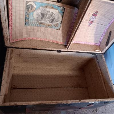 ANTIQUE TRUNK WITH DECORATIVE TIN AND LEATHER STRAPS