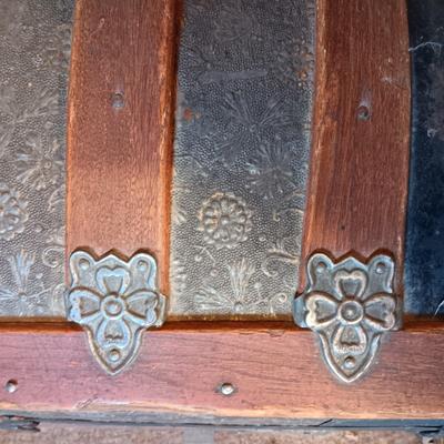 ANTIQUE TRUNK WITH DECORATIVE TIN AND LEATHER STRAPS