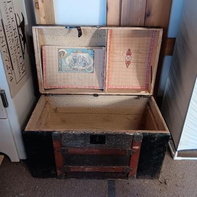 ANTIQUE TRUNK WITH DECORATIVE TIN AND LEATHER STRAPS