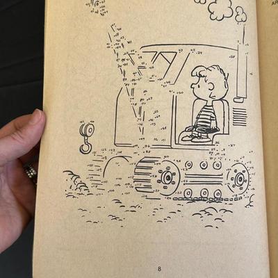 The Peanuts Vintage Figurines and an Activity Book