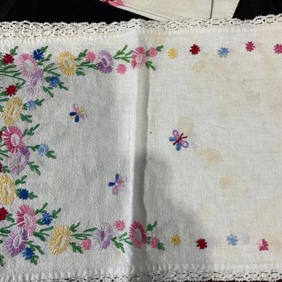 Lot of Vintage Colorful embroidered linens. Including dresser scarves