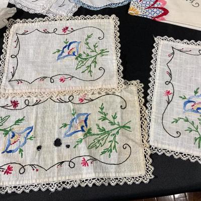 Lot of Vintage Colorful embroidered linens. Including dresser scarves