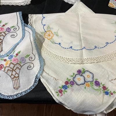 Lot of Vintage Colorful embroidered linens. Including dresser scarves