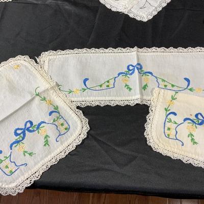 Lot of Vintage Colorful embroidered linens. Including dresser scarves