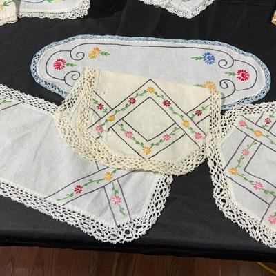 Lot of Vintage Colorful embroidered linens. Including dresser scarves