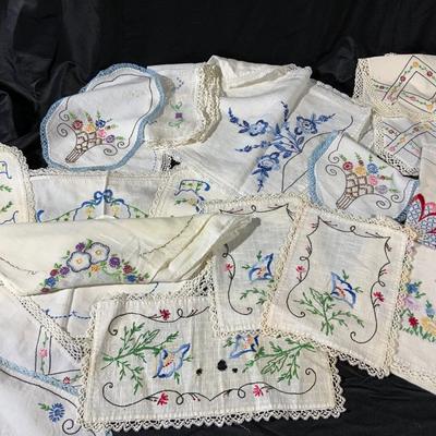 Lot of Vintage Colorful embroidered linens. Including dresser scarves