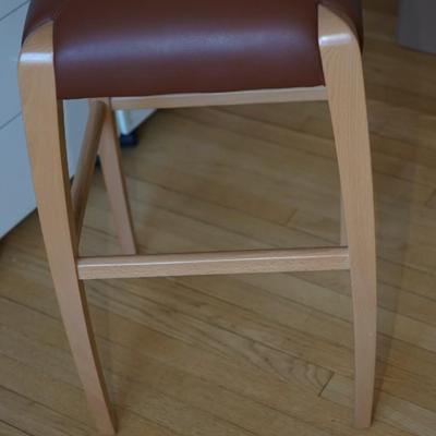 Sale Photo Thumbnail #403: Quality made stool for office or work room such as crafting table or art table
leather seat and strong support base of light wood 'contemporary style.
Height: 30"
top is approximately 16 1/2" by 16 1/2" 
very good condition