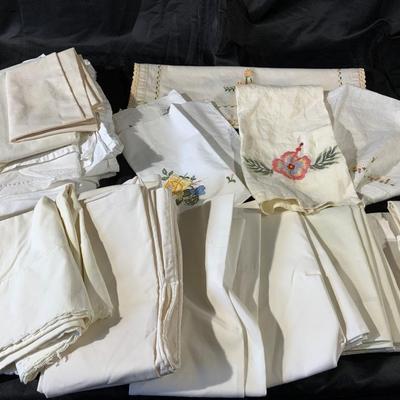 Lot of Pillowcases, sheets and dresser scarves.