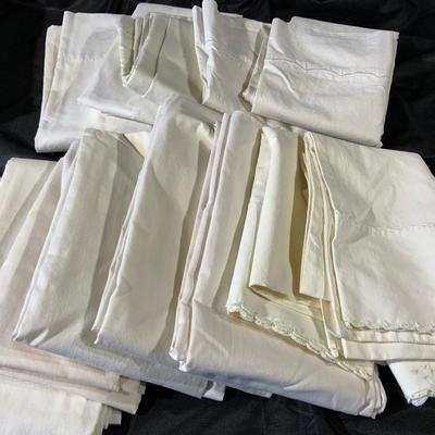 Lot of Pillowcases, sheets and dresser scarves.